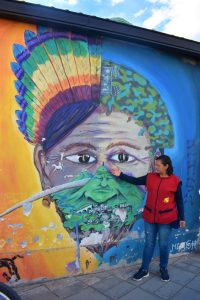 Woman explaining a mural